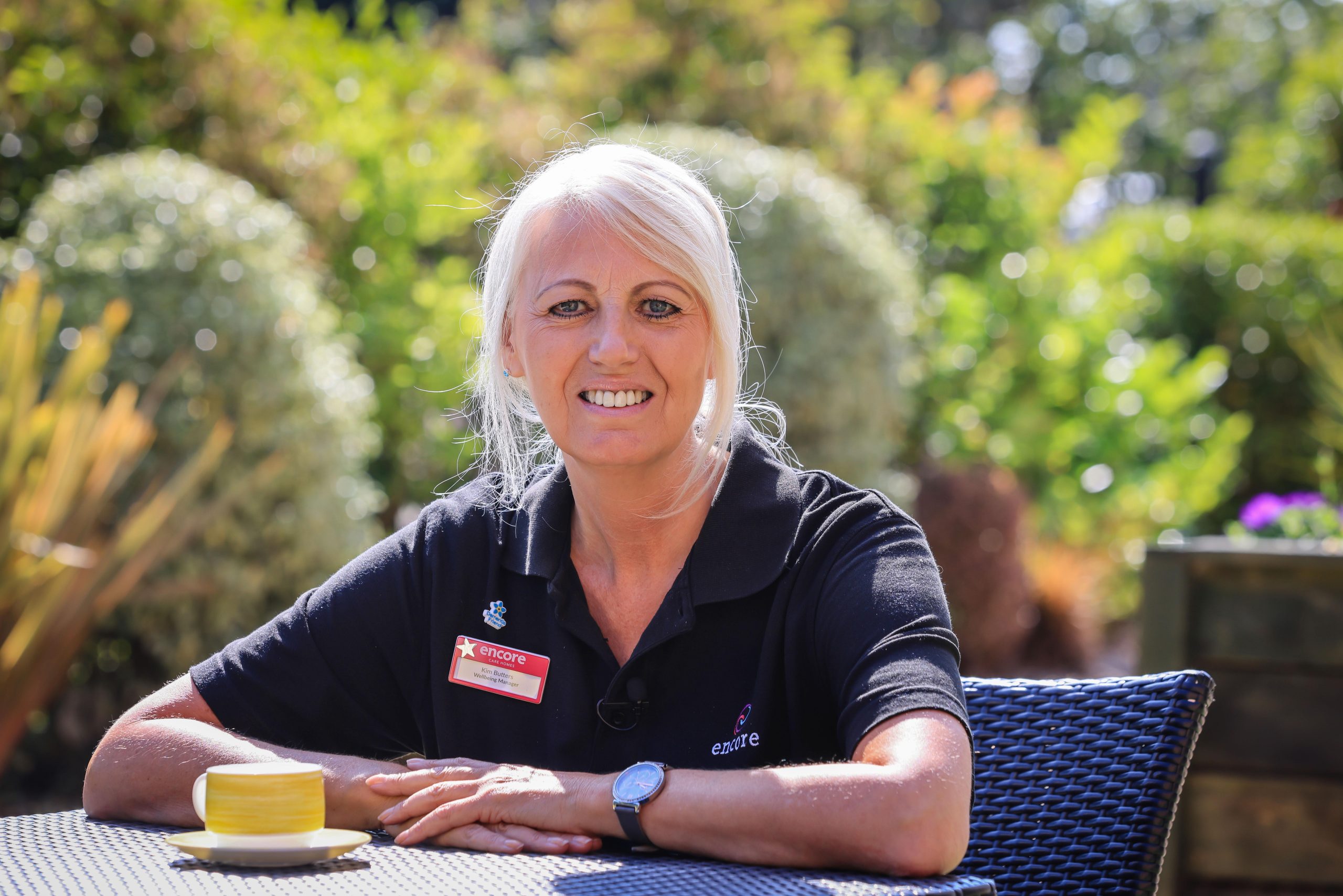 Fairmile Grange wellbeing manager smiling outdoors