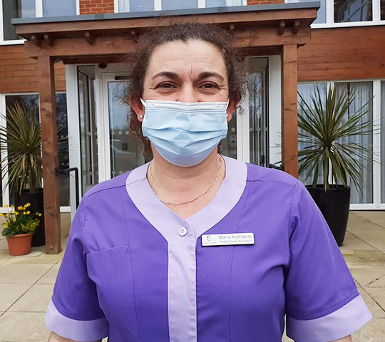 Great Oaks Healthcare Assistant wearing a blue medical mask