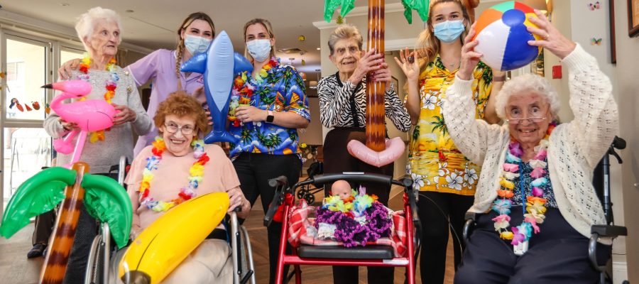 Residents from Great Oaks care home celebrating Hawaiian themed day