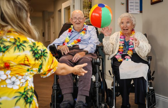 Residents at Great Oaks care home in Bournemouth enjoying a Hawaiian themed party