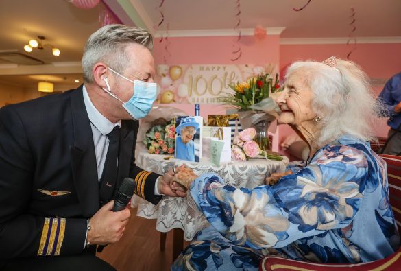 Fairmile Grange Care Home resident enjoying a party to celebrate her 100th birthday with music guest.