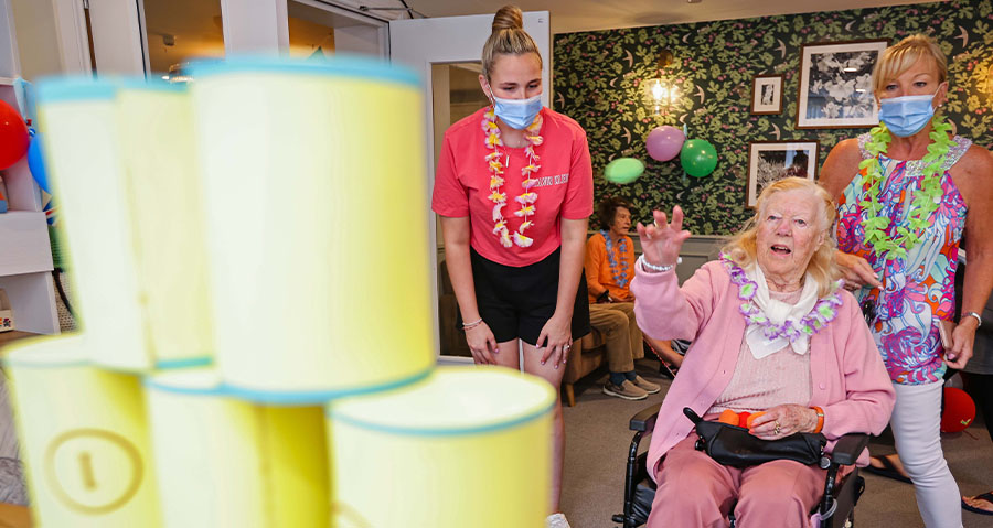 Residents at Oakdale Care Home in Poole enjoying fair games during their carnival themed day