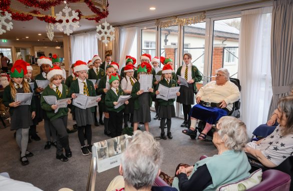 School pupils singing Christmas Carols to Oakdale care home residents in Poole