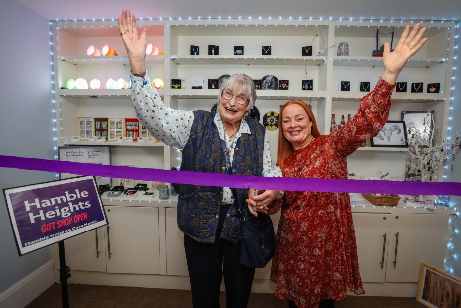 Resident Sofia opening the Hamble Heights Gift Shop with Maryanne home manager